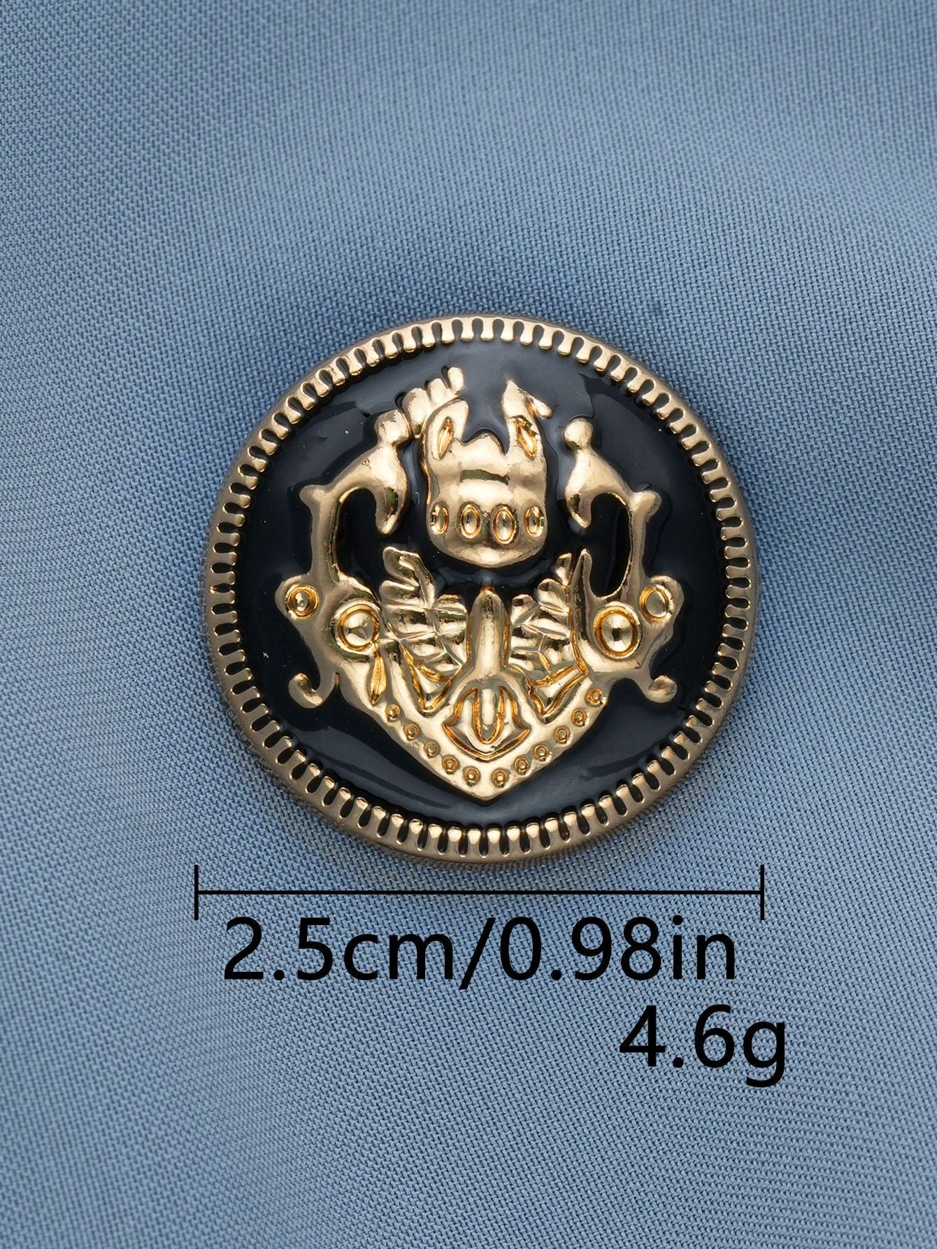 Black-base gold metal shank button, embossed crest medallion with raised border, 2.5cm.