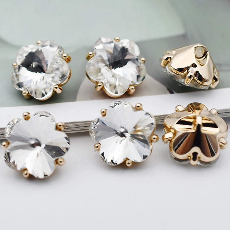 Small flower glass rhinestone shank buttons, clear white flower faces with gold-tone settings and metal shanks