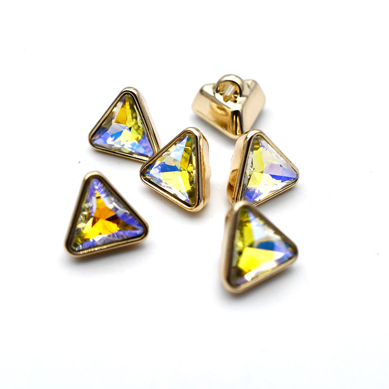 Gold-tone cuff buttons with triangular glass stones in blue and yellow iridescent colors