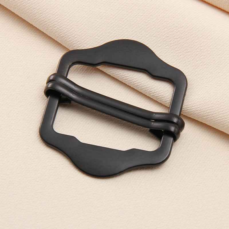 Black metal double-pin slide buckle with wavy frame, 1–3 cm