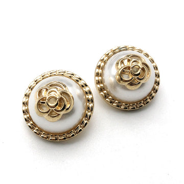 Round gold-rose pearl metal shank button, gold rim and visible shank from front
