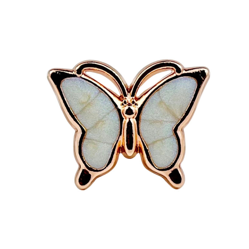Light blue 3D butterfly button with pearlescent wings, gold-tone metal shank