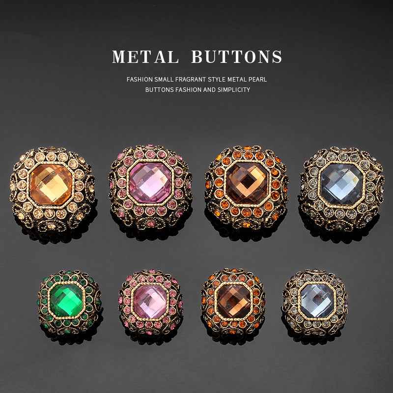 Rhinestone coat shank buttons, gold-tone settings with purple, orange, and blue-grey faceted centers
