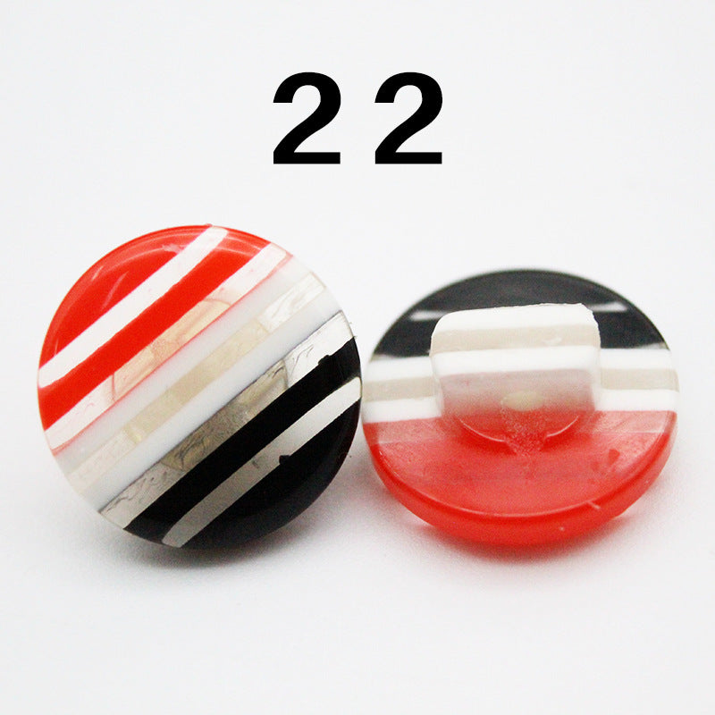 Rainbow striped resin button, red and white stripes with black accents, round shank
