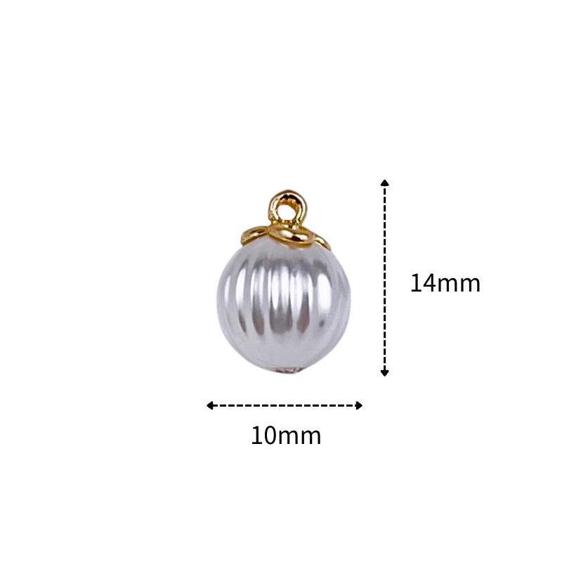 Silver ribbed pearl-shaped button with gold ring shank; size 10mm x 14mm