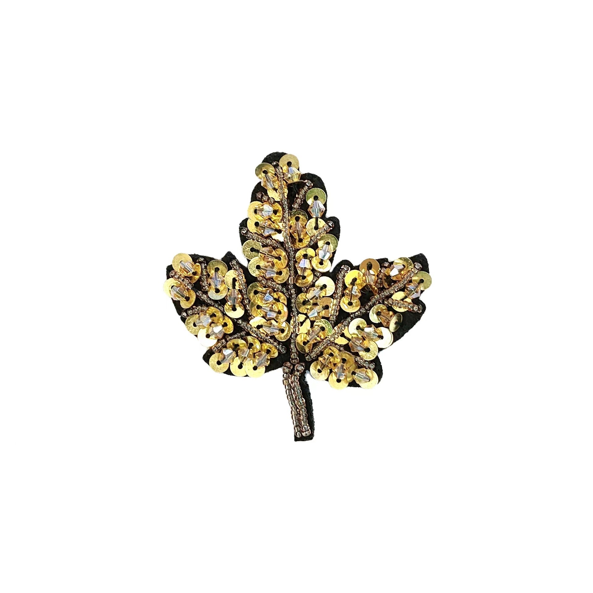 Gold sequined butterfly applique with crystal center and dark backing