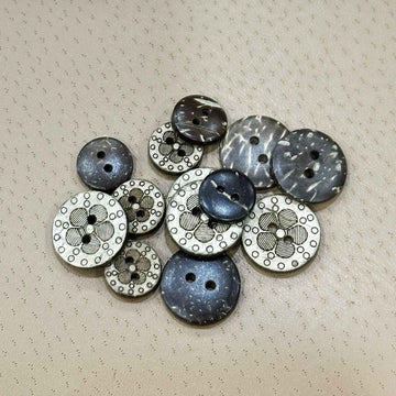 Round coconut shell buttons, dark blue-gray with white floral laser engraving, 4-hole set