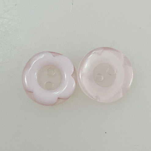 Pair of 12mm cartoon resin buttons in pale pink, 2-hole holes visible
