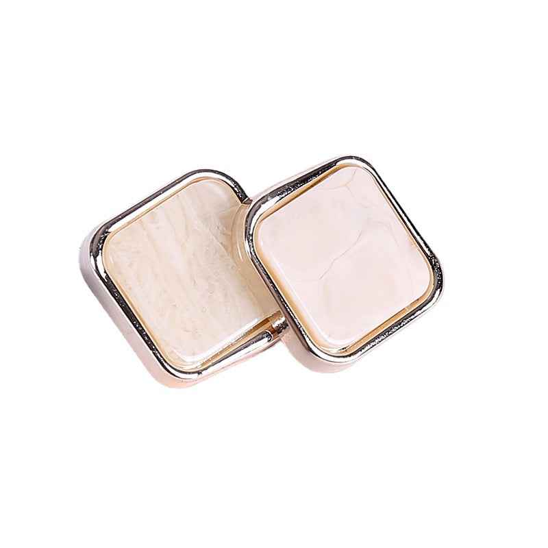 Square beveled plastic buttons with rose-gold edging and light marble reverse detail