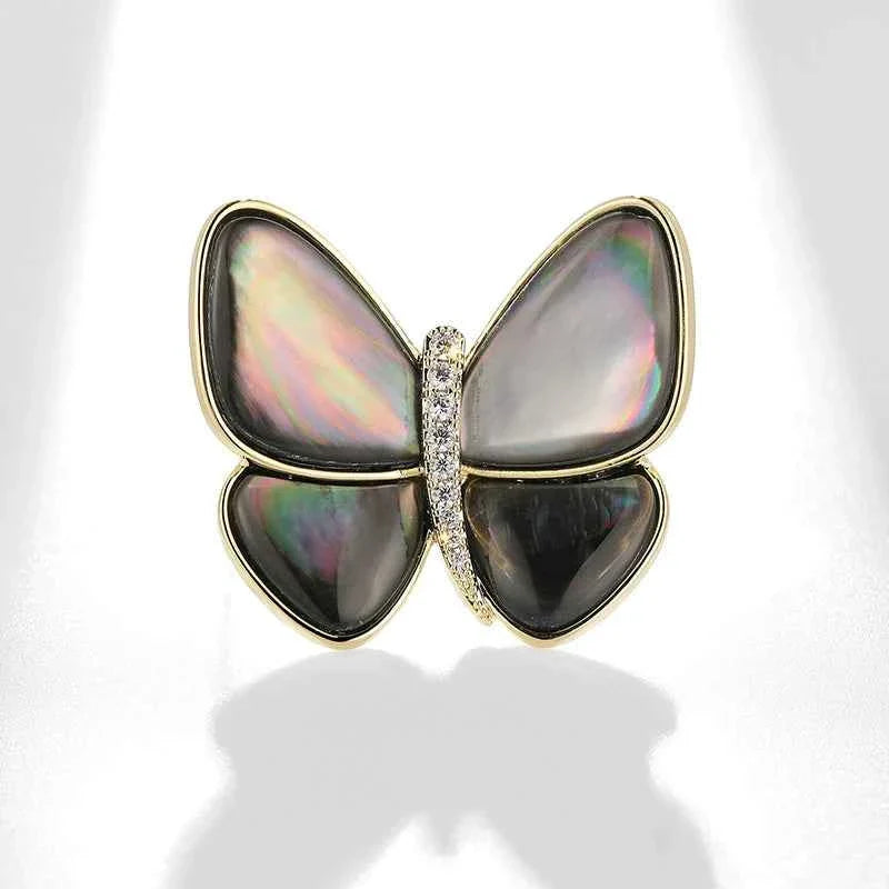 Butterfly brooch pin with dark opal-shell wings and zircon-studded center, Color B