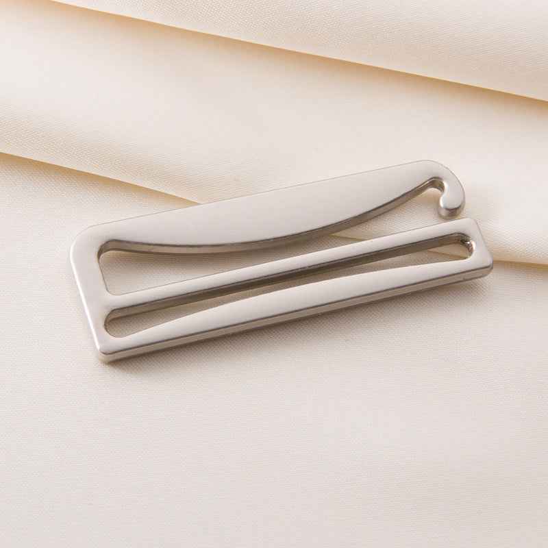 Bra strap adjuster with light frame and silver-toned sliding bar, curved hook