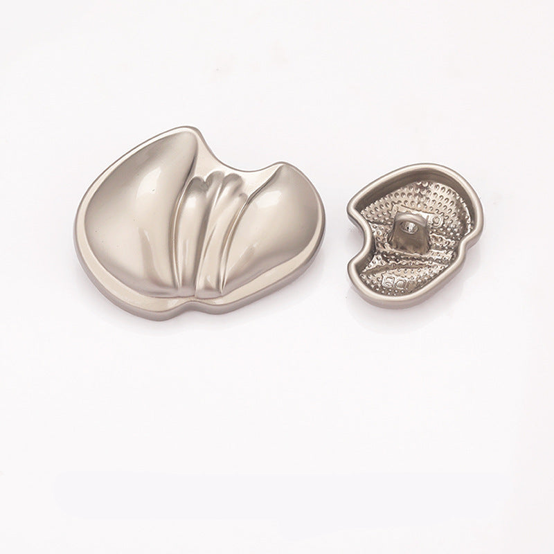 Paw-shaped metal shank button, nickel silver finish, textured underside