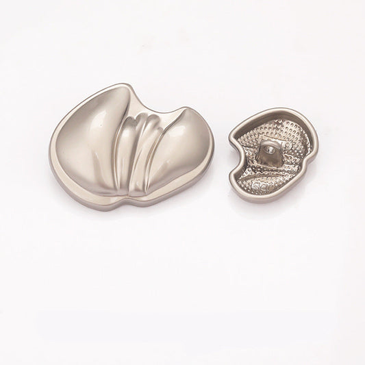 Paw-shaped metal shank button, nickel silver finish, textured underside