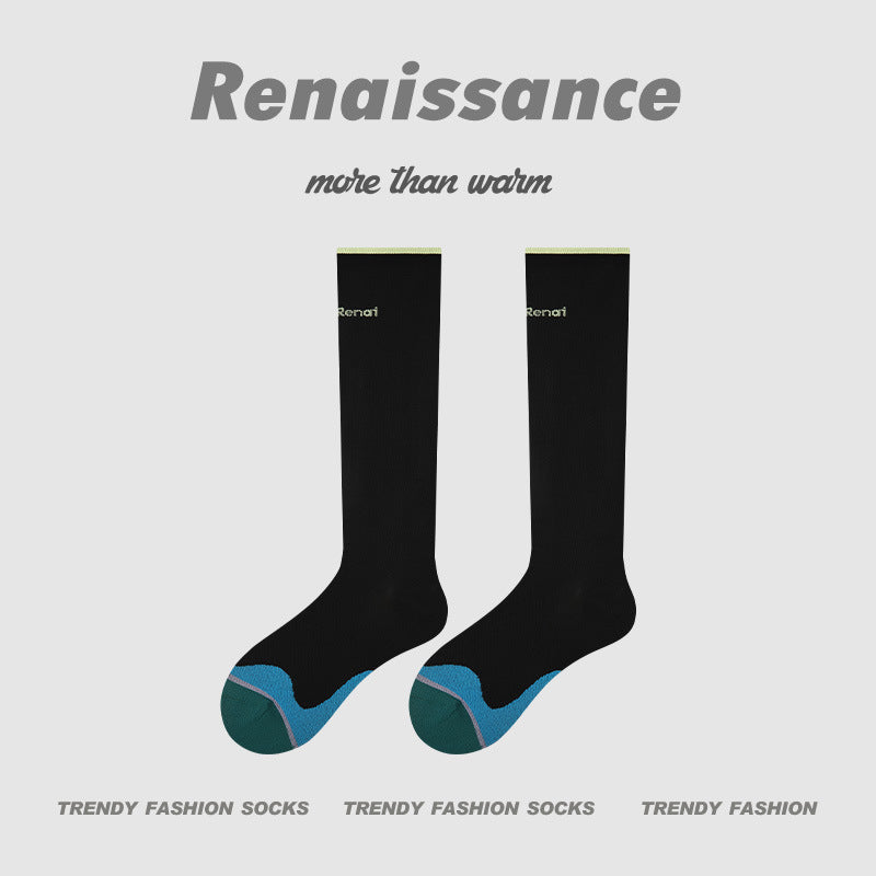 Black compression running socks with teal-green heel and foot panel, women’s crew