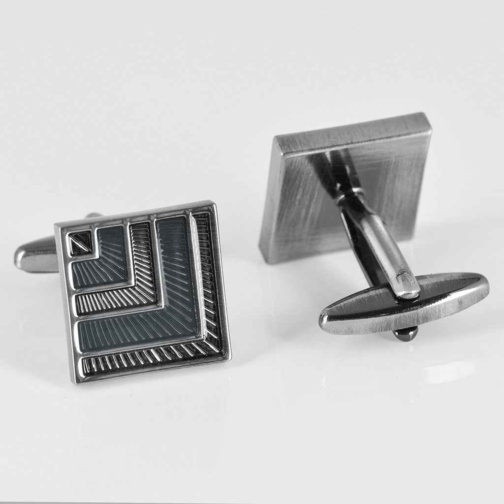 Grey-black square cufflinks with dark resin panels and engraved linear detailing