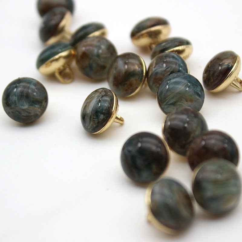Dark greenish cat-eye shank buttons with gold loop backs, round, mixed batch