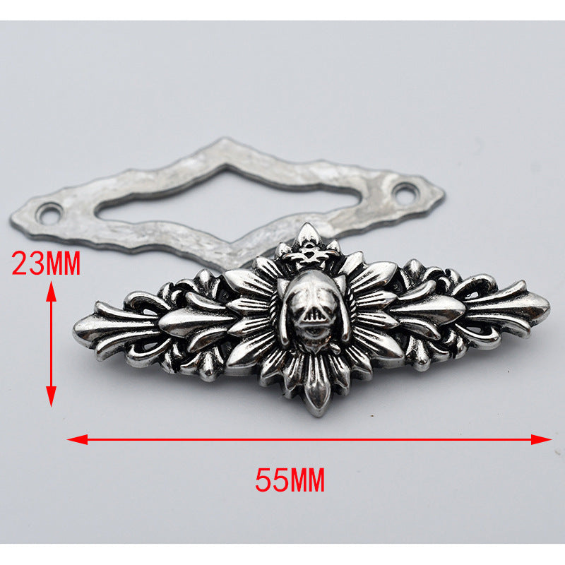 Skull-centered metal stud with bar back plate, ornate raised details, 55mm