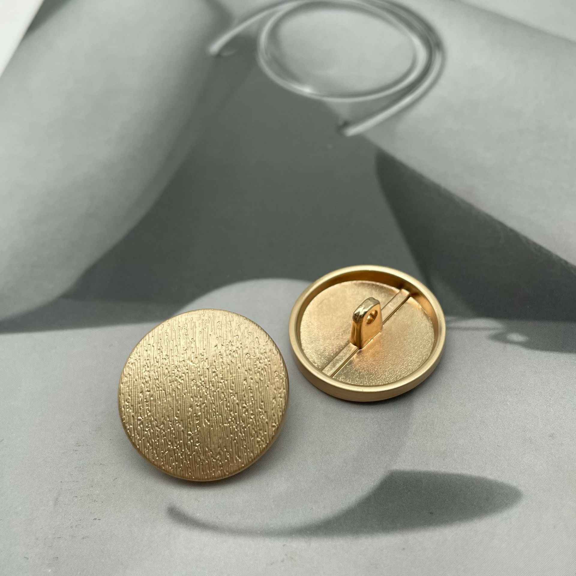 1-inch round matte metal shank button, tea gold textured front with back