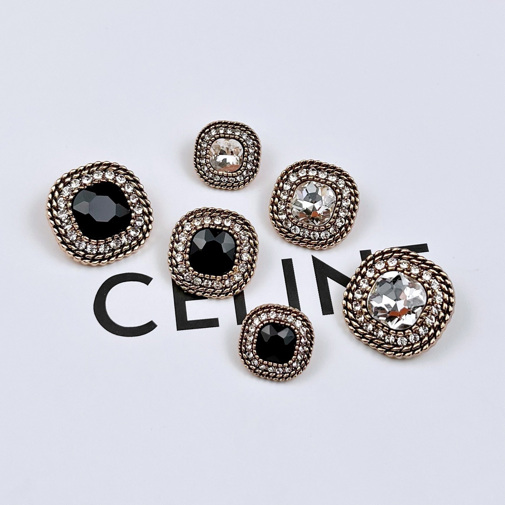 Assorted vintage metal shank buttons with black and white crystals, gold-tone settings