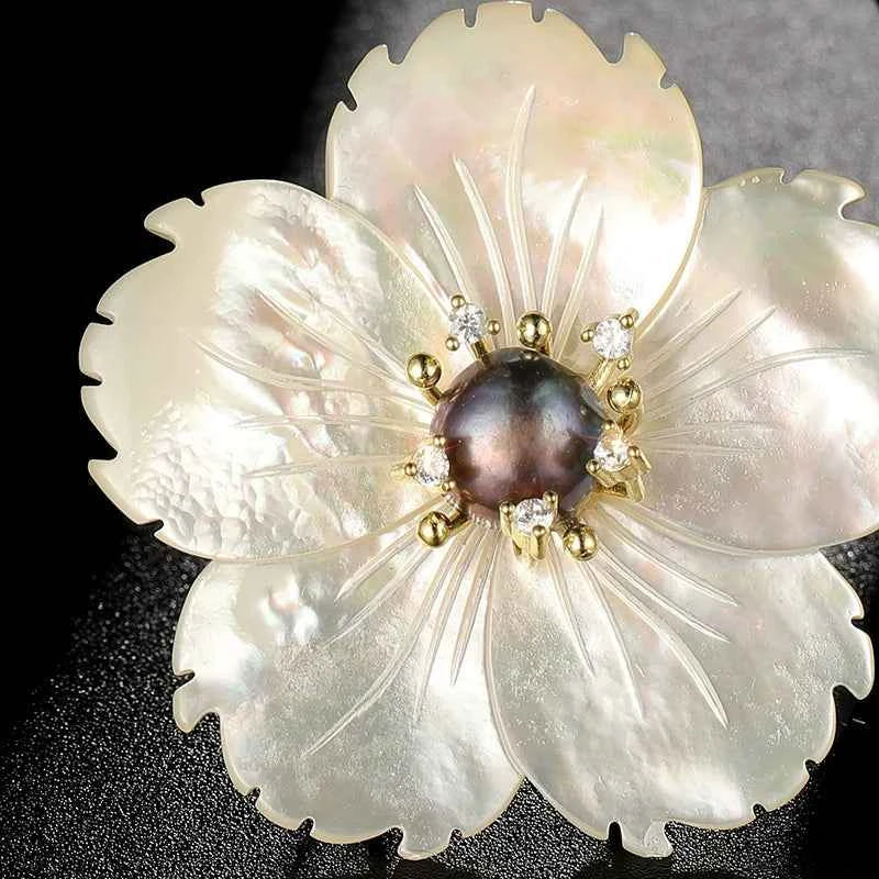 Large natural shell baroque flower brooch with dark pearl cabochon and crystal accents