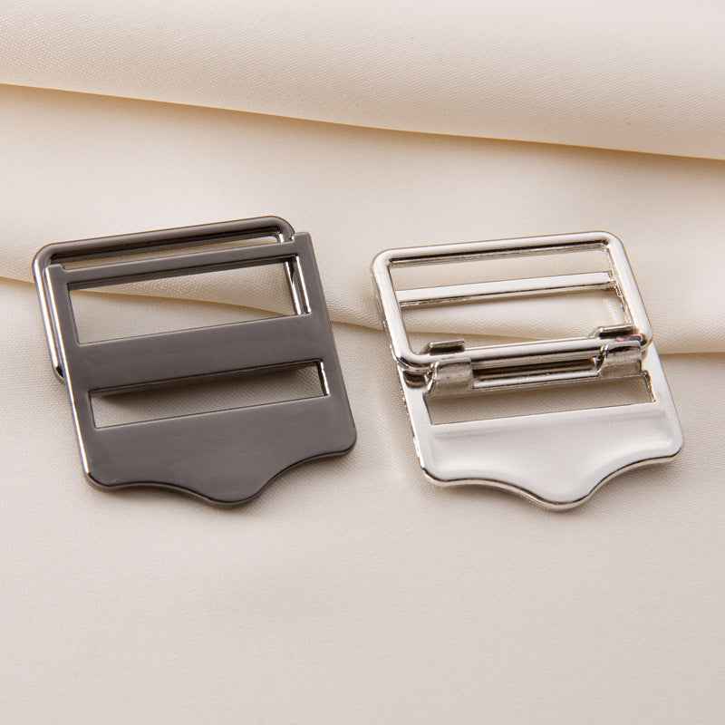 Metal backpack strap buckles, gray and white/cream versions with silver frames