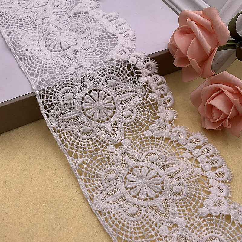 White floral embroidered lace trim with scalloped edge and repeating circular medallions