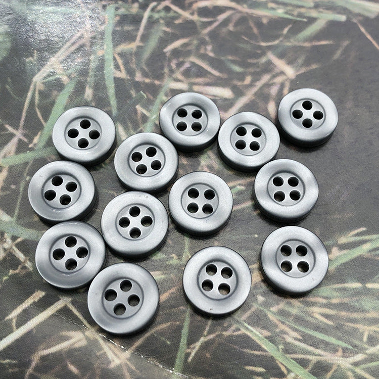 Round resin shirt buttons, 4-hole, silver grey, multiple button fronts on display