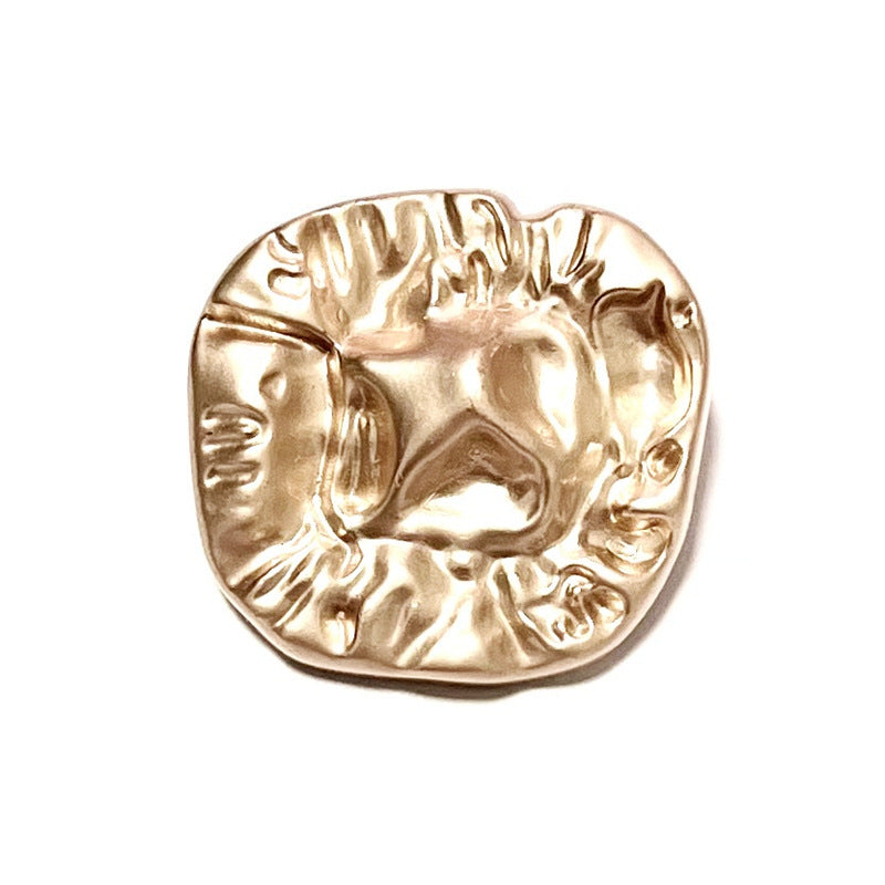 Gold alloy irregular quadrilateral button with raised embossed surface