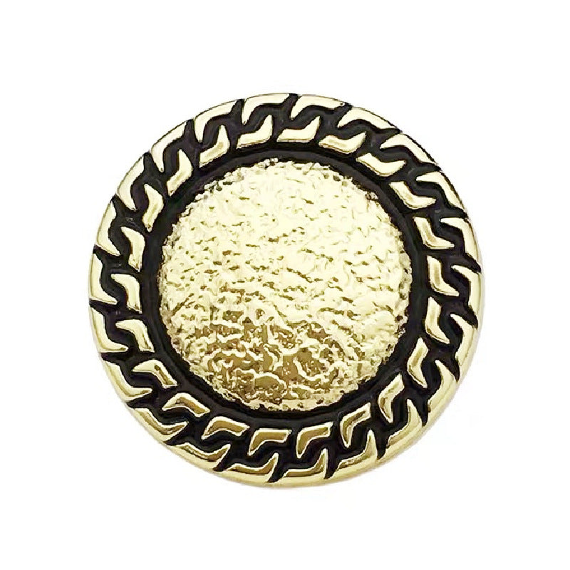 Black chain-edged round metal button with gold textured center