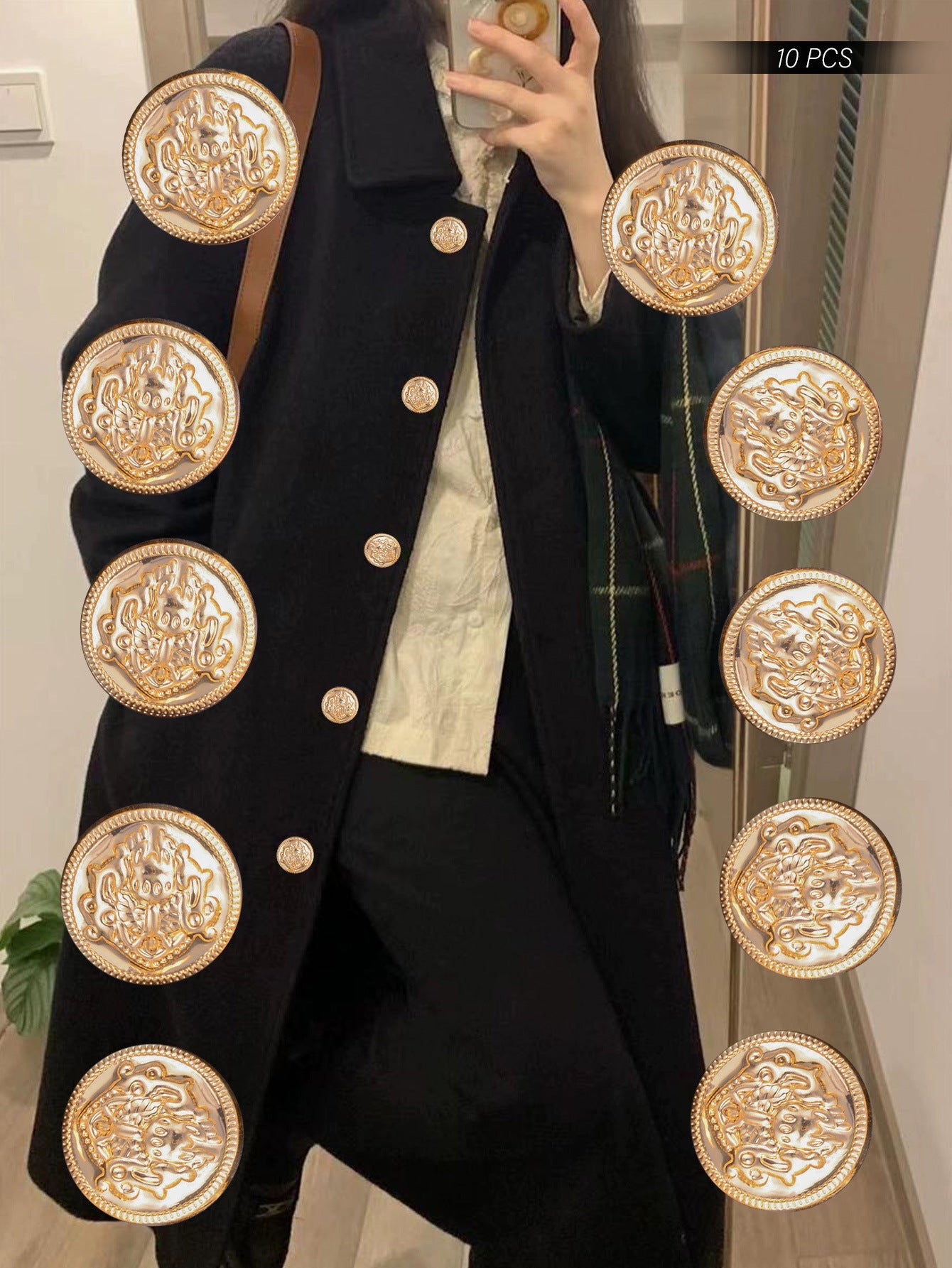 Gold-embossed shank buttons on a dark coat front panel, crest medallion style.