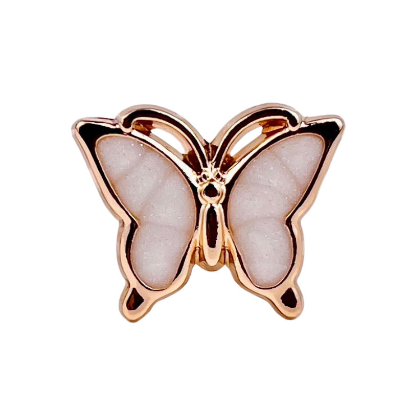 Light pink 3D butterfly button with pearl-like wings and metal shank
