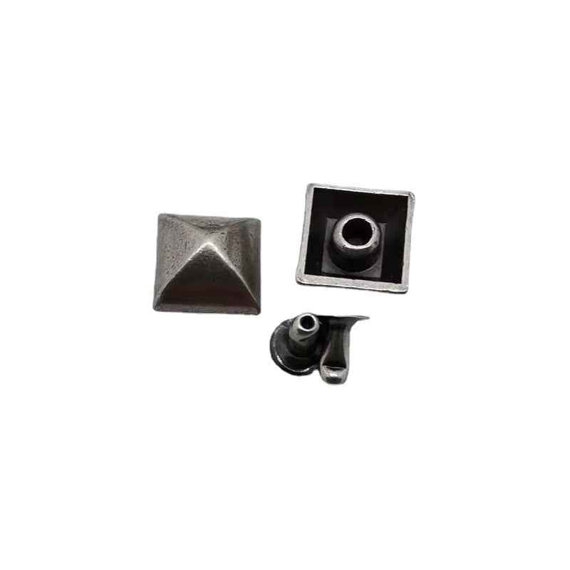 Silver pyramid stud rivet with square face and star-shaped peak plus backing piece