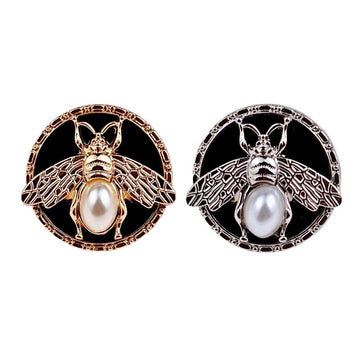Round bee pearl metal shank buttons, gold and silver with black enamel center