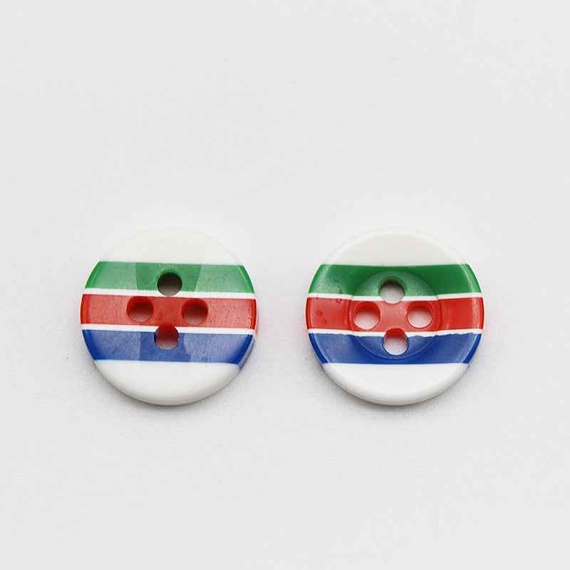Two round resin buttons with 4 holes, candy stripes: green, red, blue on white