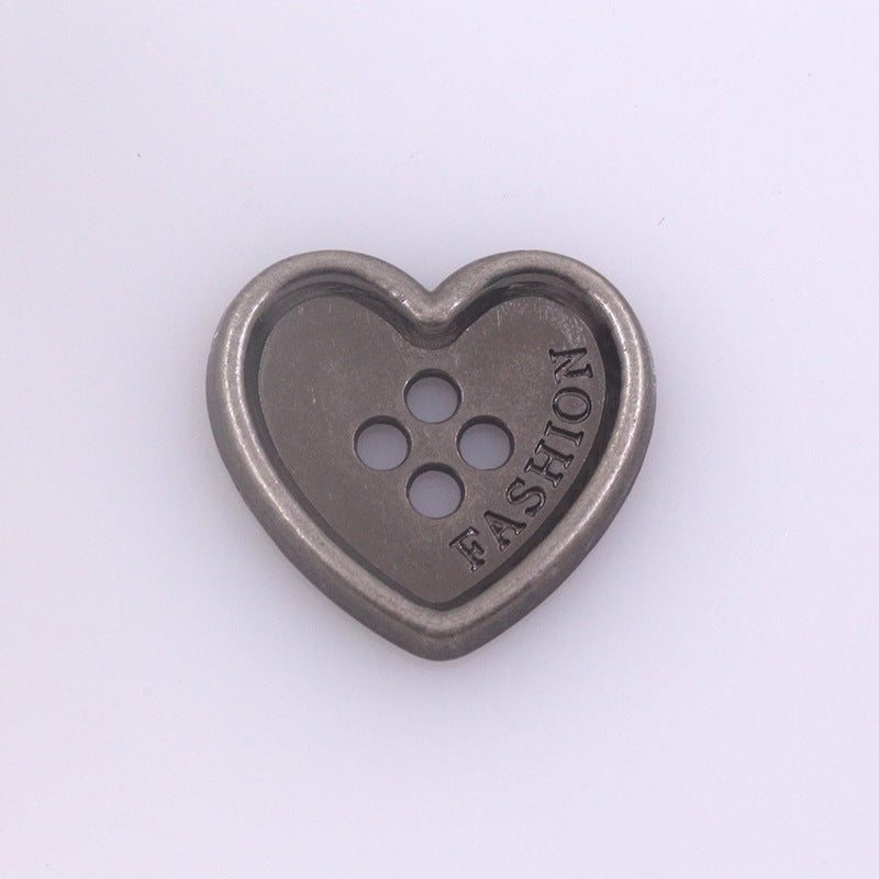 Single heart-shaped metal button with four holes, dark silver finish