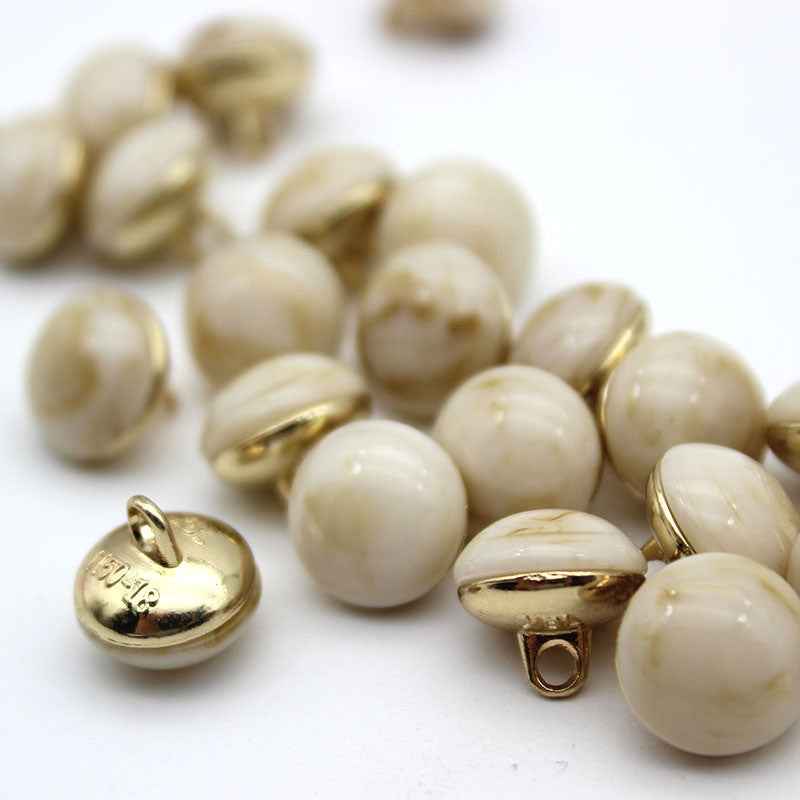 Cream cat-eye shank buttons, round with gold loop shanks, mixed batch