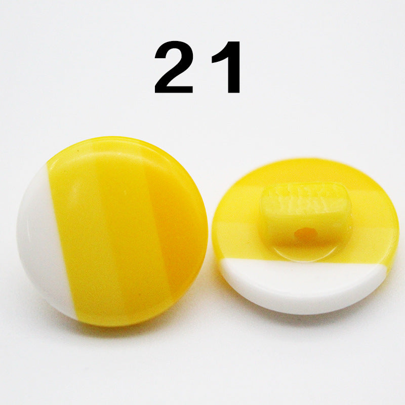 Yellow resin button, round with smooth finish and visible shank attachment