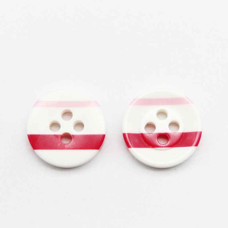 Pair of white round resin buttons with red stripe and pink top band, four holes