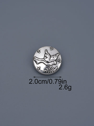 Silver-toned embossed metal shank button with flying bird design, ~2.0cm