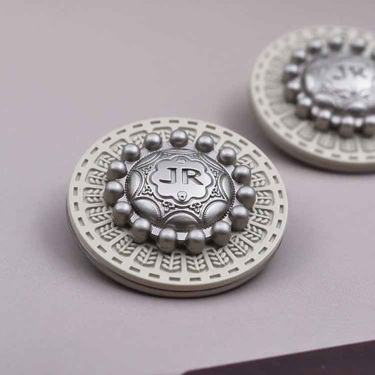 Round vintage metal shank button, silver center with white base and bead border