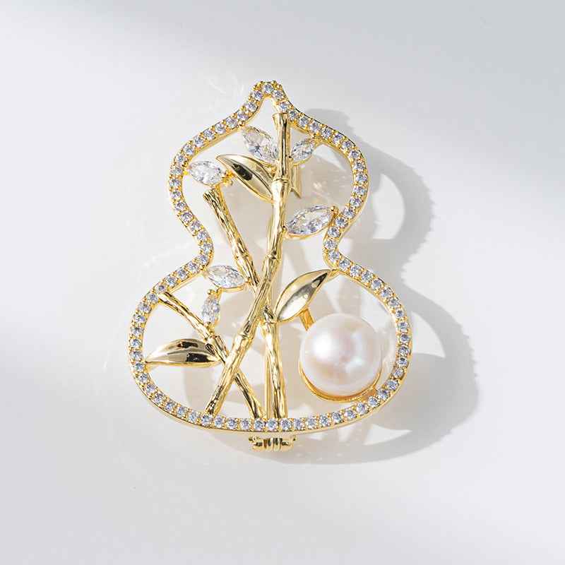 Bamboo gourd brooch with white pearl and sparkling stones, copper-tone metal
