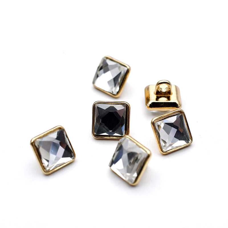 Gold metal shank cuff buttons with light clear and dark square glass stones