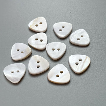 Natural shell triangular 2-hole shirt buttons, 20 pcs, white/cream top view