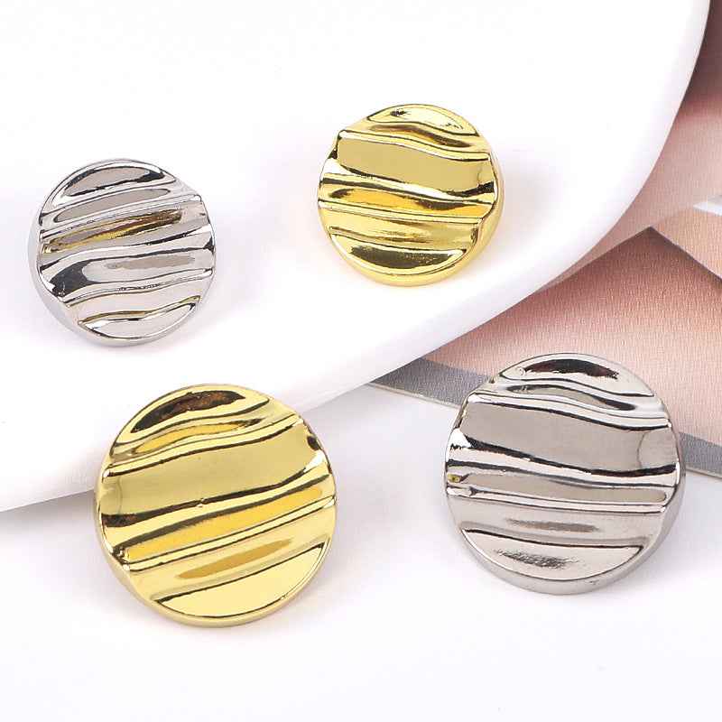 Assorted gold and silver crinkle wave metal shank buttons, front views