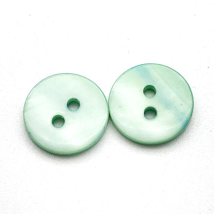 Light green round two-hole flat shirt buttons, 12.5mm, close-up (20 pcs)