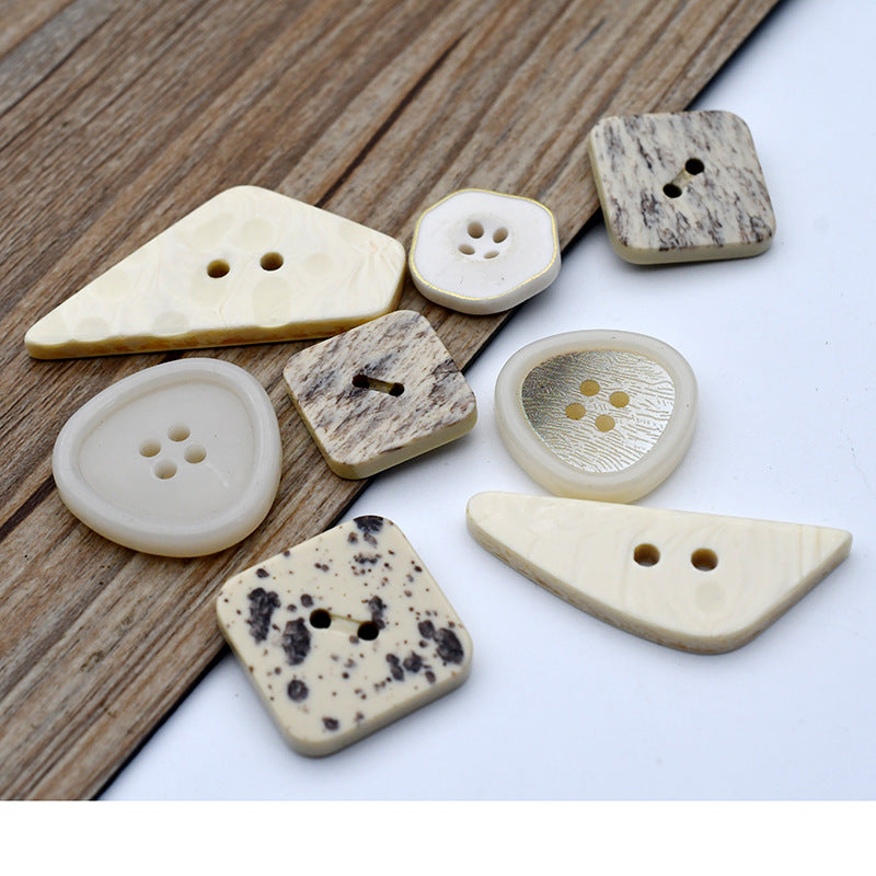 Beige marble resin decorative buttons, irregular shapes, mix of 2- and 4-hole styles