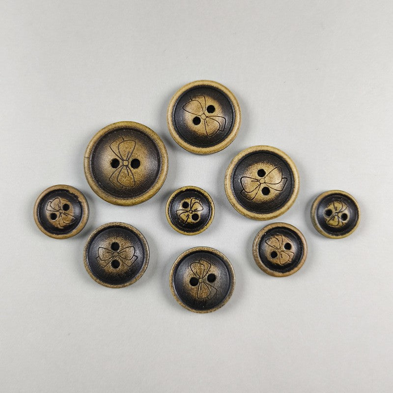 Mixed-size round wood butterfly pattern buttons, each with two-hole layout