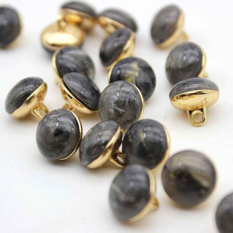 Dark gray cat-eye shank buttons with gold loop backs, round, mixed set