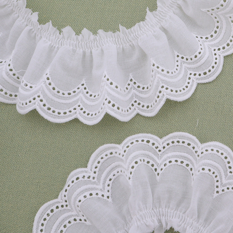 White lace trim with pleated double waves and small green eyelet embroidery