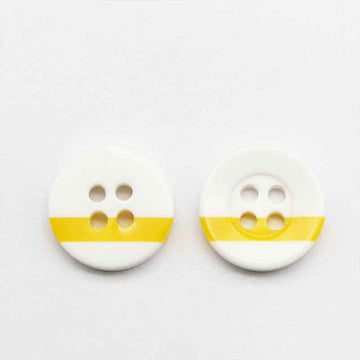 White round resin button with four holes and yellow stripe across the front